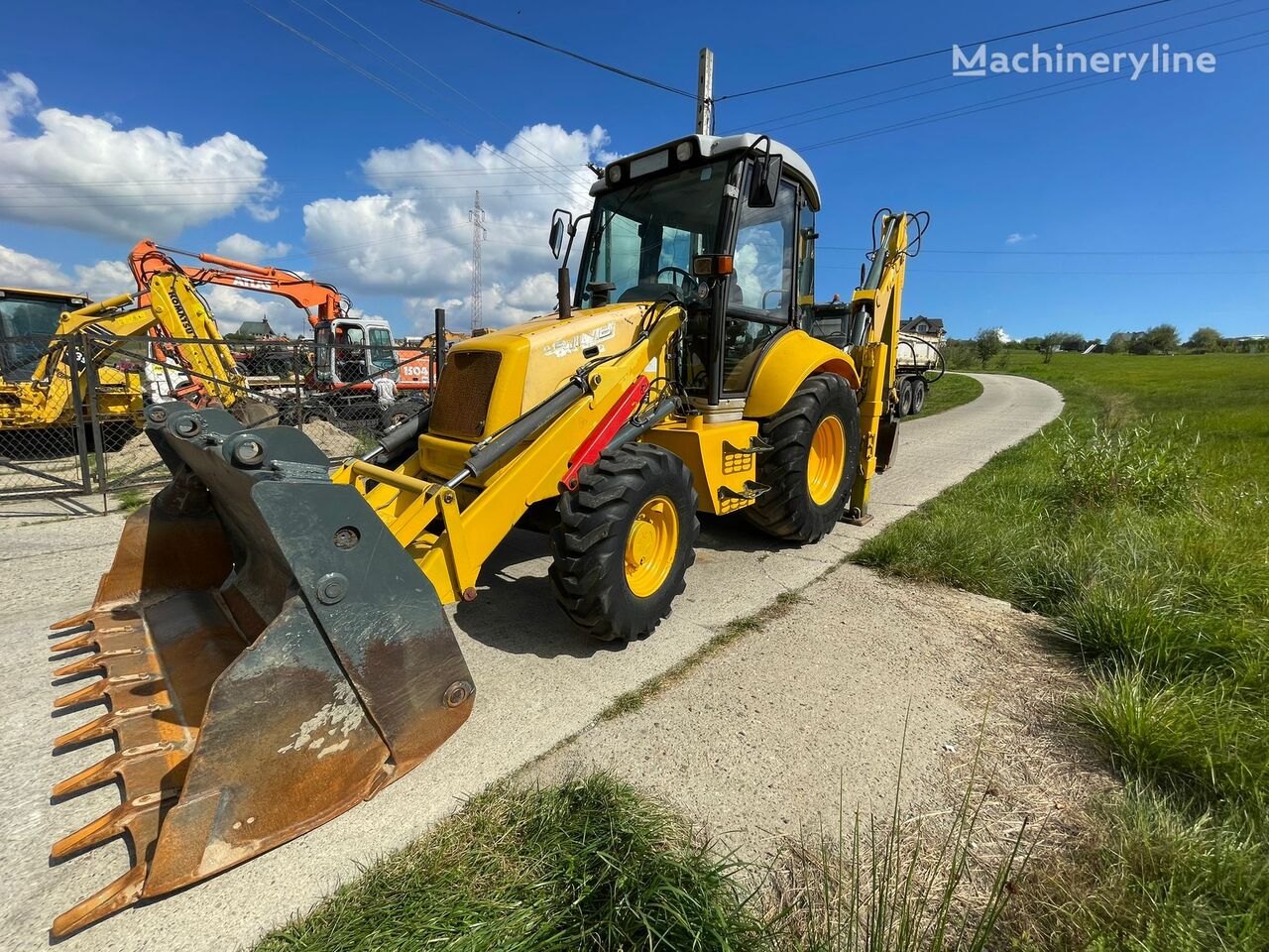 buldoexcavator NEW HOLLAND LB 110
