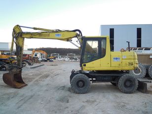 excavator pe roţi Caterpillar M312